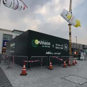 Skincare Products Suspended on Crane in a fake-out-of-home ad of Garnier