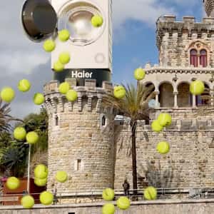 Washing Machine Spills Tennis Balls in a fake-out-of-home ad of Haier