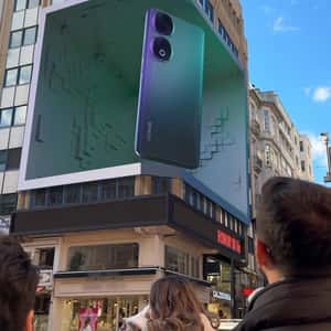 Basketball Emerges from Smartphone in a fake-out-of-home ad of Honor