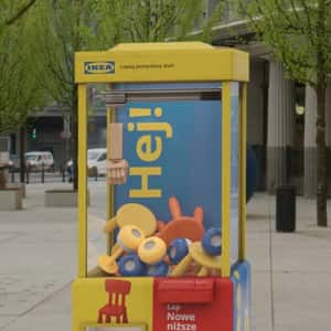 Furniture Claw Machine in a fake-out-of-home-ad of IKEA