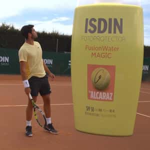 Sunscreen Bottle Lands at Tennis Court in a fake-out-of-home ad of ISDIN