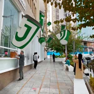 Coffee Cups Drops on the Street in a fake-out-of-home ad of J.Cafe