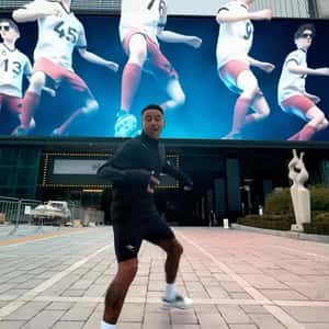 Dancing Players on Digital Screen in a fake-out-of-home ad of Jesse Lingard
