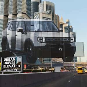 SUV Projected on Skyscrapers in a fake-out-of-home ad of Jetour