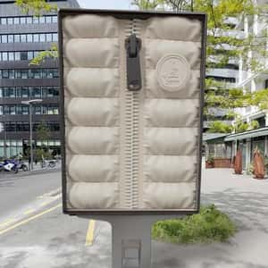 Street Ad Unzips like Puffer Jacket in a fake-out-of-home ad of JOTT