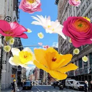 Bubbles Burst into Flowers in a fake-out-of-home ad of Kate Spade