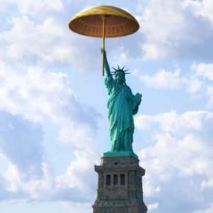 Lady Liberty Wears an Umbrella in a fake-out-of-home ad of Kerala Tourism