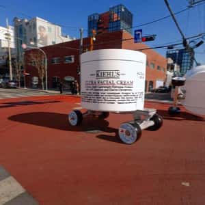 Facial Cream on Wheels Tips Over iin a fake-out-of-home ad of Kiehl's
