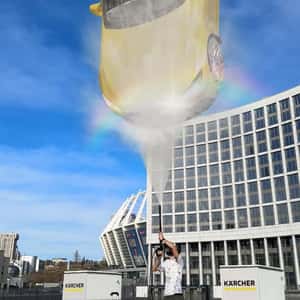 Car Lifted by Pressure Cleaner in a fake-out-of-home ad of Kärcher