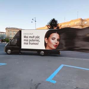 Model’s Hair Streams Out of Promo Van in a fake-out-of-home ad of Labo Suisse