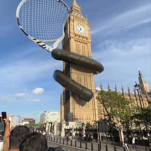 Tennis Racket Wraps Around Big Ben in a fake-out-of-home ad of Wimbledon