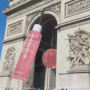 Essence Bottle Swings at Monument in a fake-out-of-home ad of Melvita