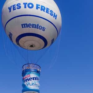 Gum Bottle Hot Air Balloon in a fake-out-of-home ad of Mentos