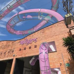 Hairbrushes Glide on Water Slide in a fake-out-of-home ad of Milagros