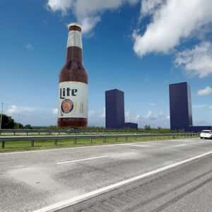Beer Bottle Stands Beside Highway in a fake-out-of-home ad of Miller Lite