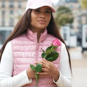 Pink Roses Bloom on Clock Tower in a fake-out-of-home ad of Musc Intime