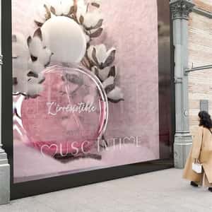 Cotton Blooms Beside Perfume Bottle in a fake-out-of-home ad of Musc Intime
