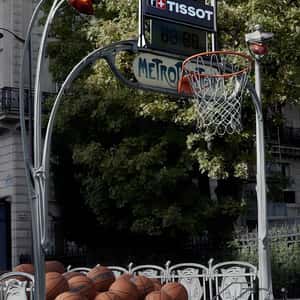 Basketballs Roll Up Subway Stairs in a fake-out-of-home ad of Tissot