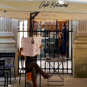 Barista Fox Reads Newspaper in a fake-out-of-home ad of Café Kitsuné
