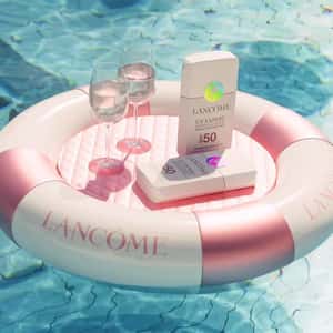 Sunbathing Sunscreens in a fake-out-of-home ad of Lancôme