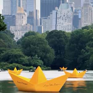 Yellow Paper Boats in a fake-out-of-home ad of Veuve Clicquot
