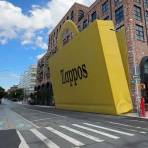 Yellow Paper Bag Reveals Footwear in a fake-out-of-home ad of Zappos