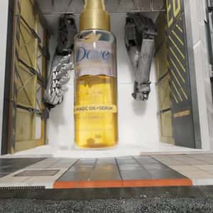 Hair Serum Appears at Mechanic Shop in a fake-out-of-home ad of Dove