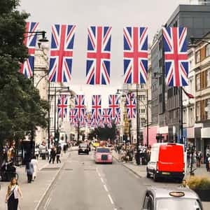 Flags Transform into Product Banners in a fake-out-of-home ad of Space NK