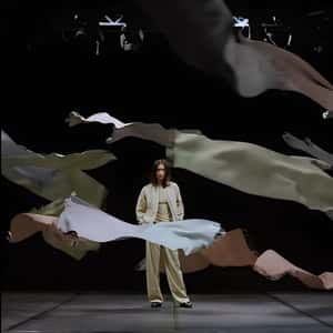 Scarves Elegantly Float at a Lady in a fake-out-of-home ad of DRYKORN