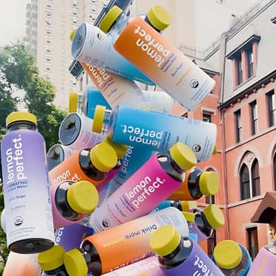 Bottles Stacked Midair From Keycap in a fake-out-of-home ad of Lemon Perfect
