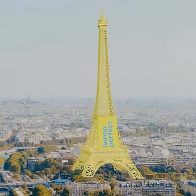 Eiffel Tower Turns Lemon Yellow Hue in a fake-out-of-home ad of Lemon Perfect