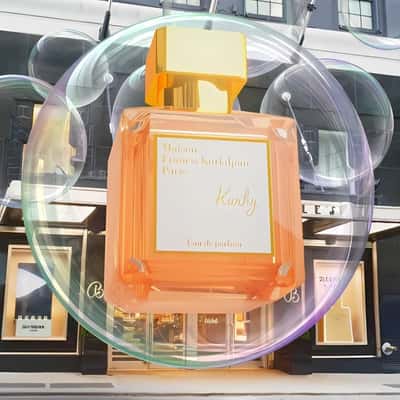 Perfume Bottle Riding Inside the Bubble in a fake-out-of-home ad of Bloomingdale’s