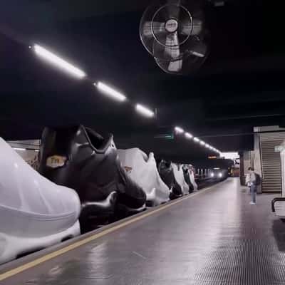 Shoes Line Up Like Train Wagons in a fake-out-of-home ad of Foot Locker