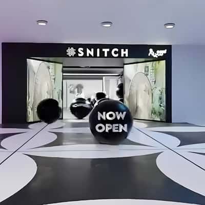 Black Balls Rolling Out From the Store in a fake-out-of-home ad of Snitch