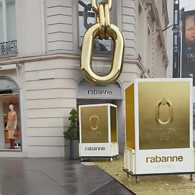 Perfume Box Spills Perfume Bottles in a fake-out-of-home of Rabanne