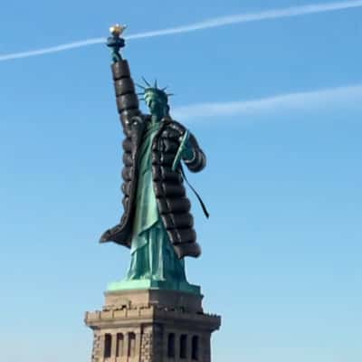 Statue of Liberty Wearing Trench Coat in a fake-out-of-home ad of DKNY