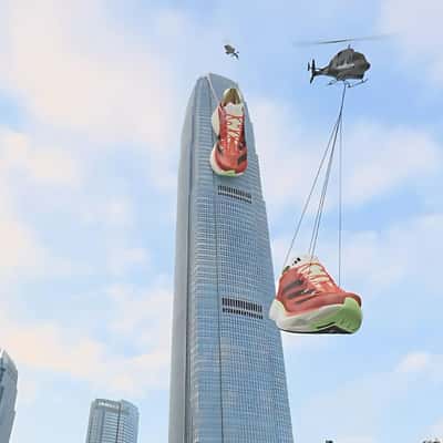Running Shoes Spotted On Top Of Building in a fake-out-of-home ad of Adidas