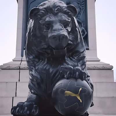 Lion Statue Holds Soccer Ball in a fake-out-of-home ad of PUMA
