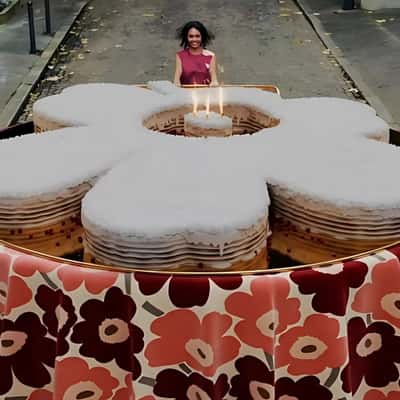 Woman Pushing Flower Cake in a fake-out-of-home ad of Marimekko