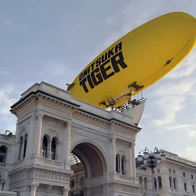 Airship Carrying Banner in a fake-out-of-home ad of Onitsuka Tiger