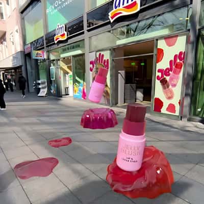 Jelly Blush Sticks Jumps Over Fallen Jellies in a fake-out-of-home ad of DM