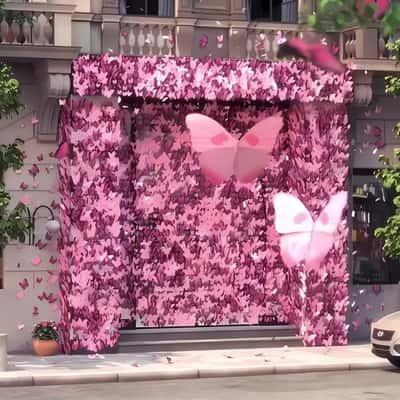 Door Covered with Butterflies in a fake-out-of-home ad of Les Secrets de Loly