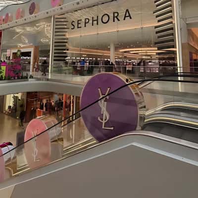 Blush Powder Riding on Escalator in a fake-out-of-home ad of Sephora