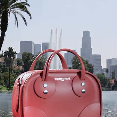 Bag Cruising Above the Lake in a fake-out-of-home ad of Maison Kitsuné