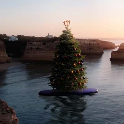 Christmas Tree Rides on Paddle Board in a fake-out-of-home ad of Club Med
