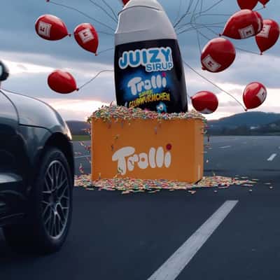 Box Overflowing with Gummies in a fake-out-of-home ad of Kaufland