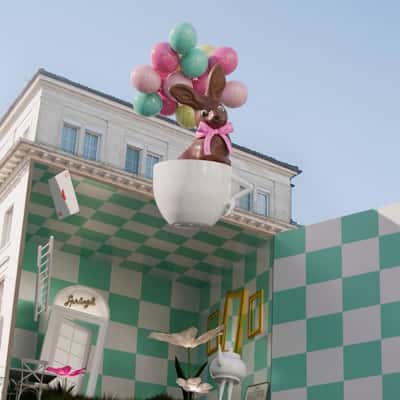 Cup Floats from Building in a fake-out-of-home ad of Confiserie Sprüngli