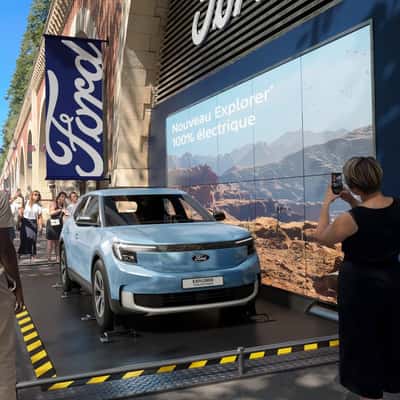Flipping Car Display in a fake-out-of-home ad of Ford