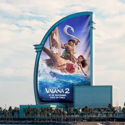 Movie Poster Rolls Down on Building in a fake-out-of-home ad of Disney