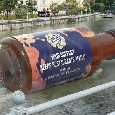 Chili Sauce Bottle Floating on River in a fake-out-of-home ad of Chope
